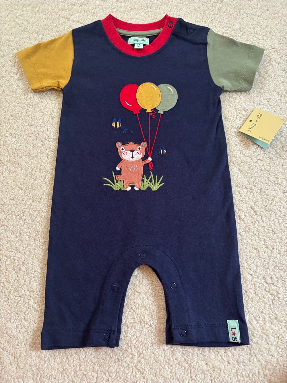 Tea Collection Navy One-Piece Romper with Red, Yellow, Olive Accents